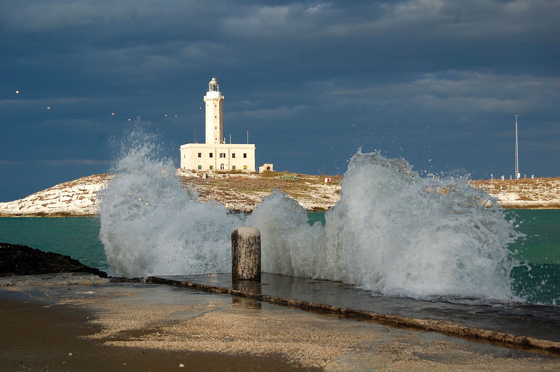 Lighthouse among the rushing waves