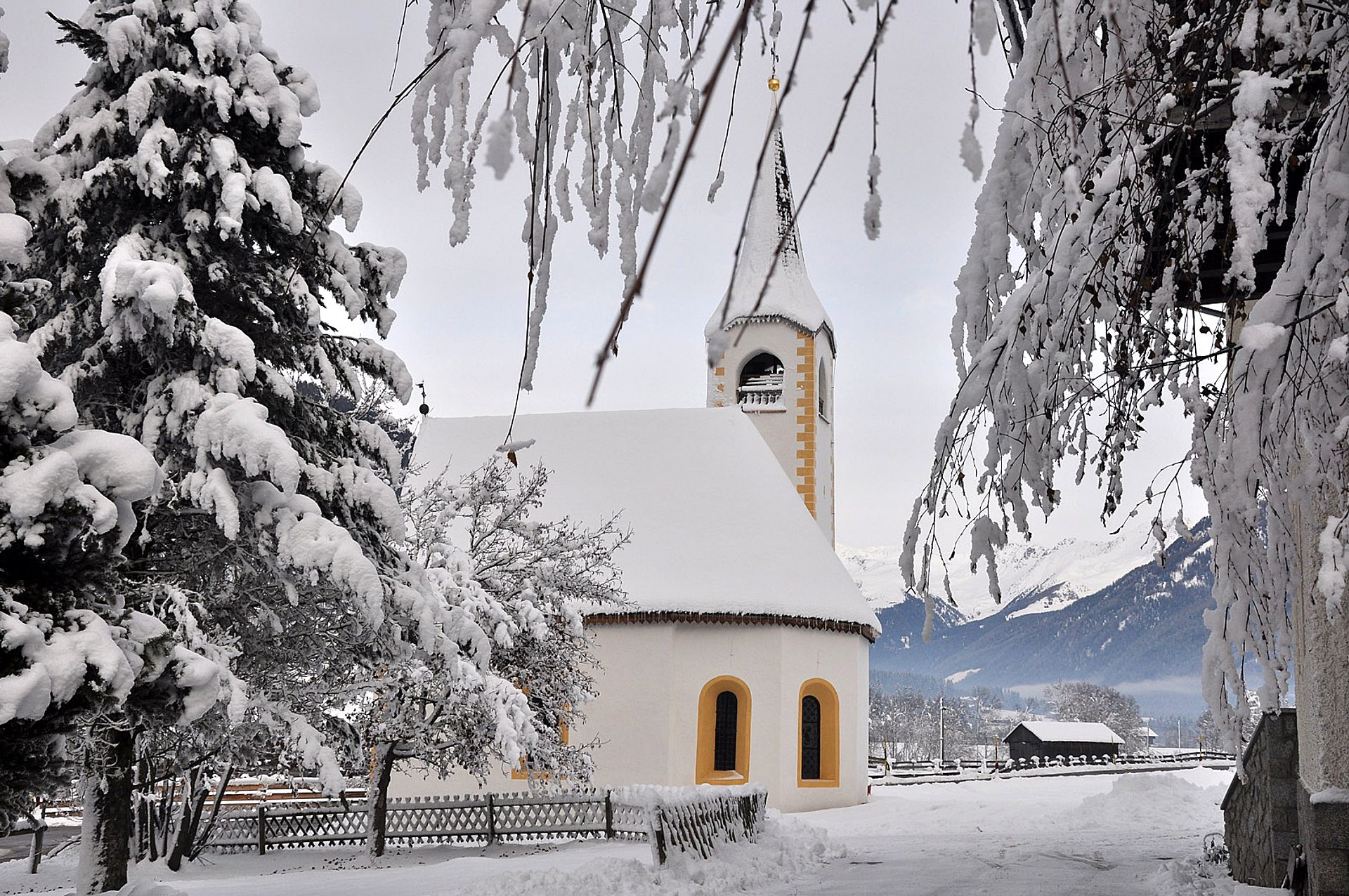 Little white church under the snow