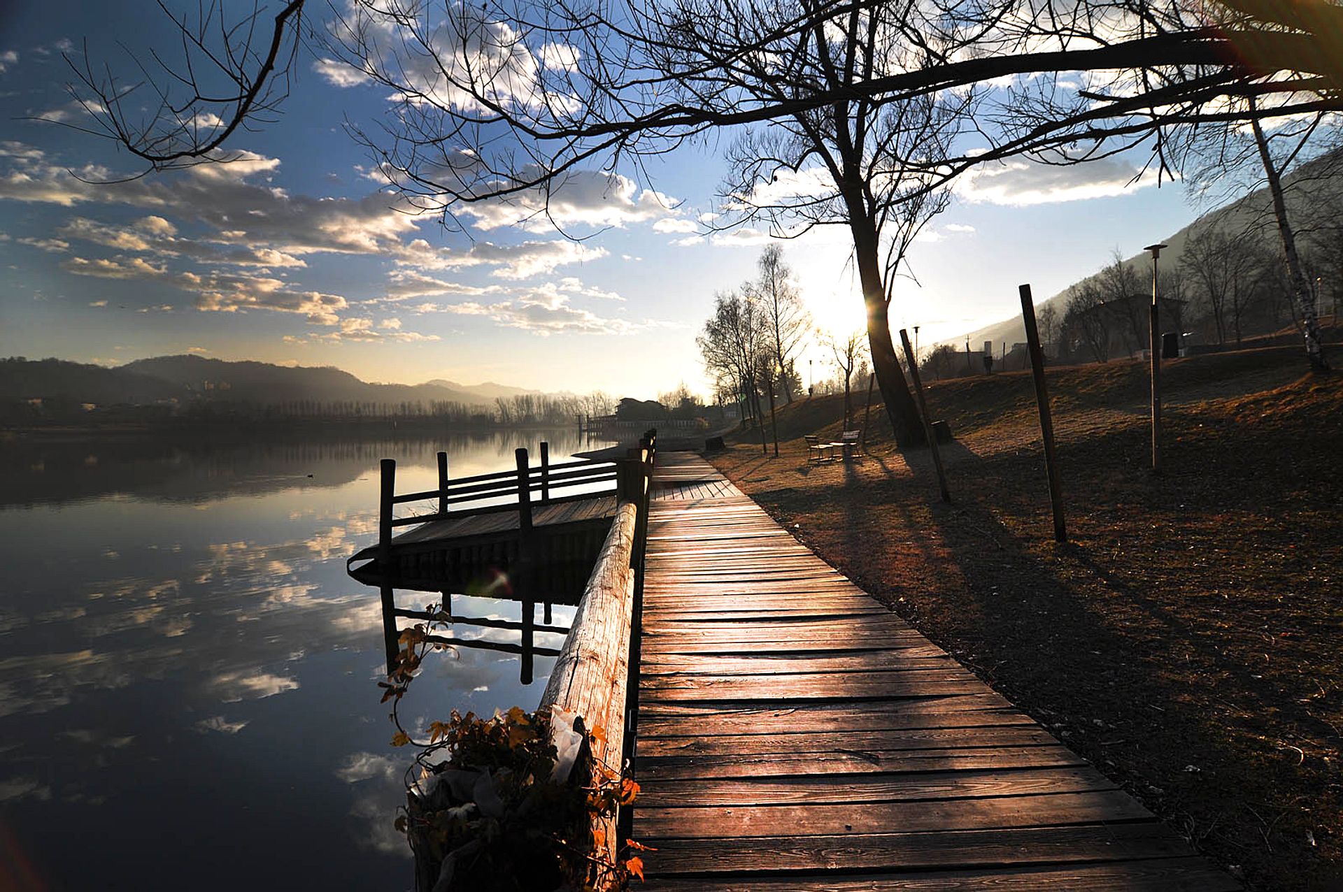 Footbridge over the lake at sunset