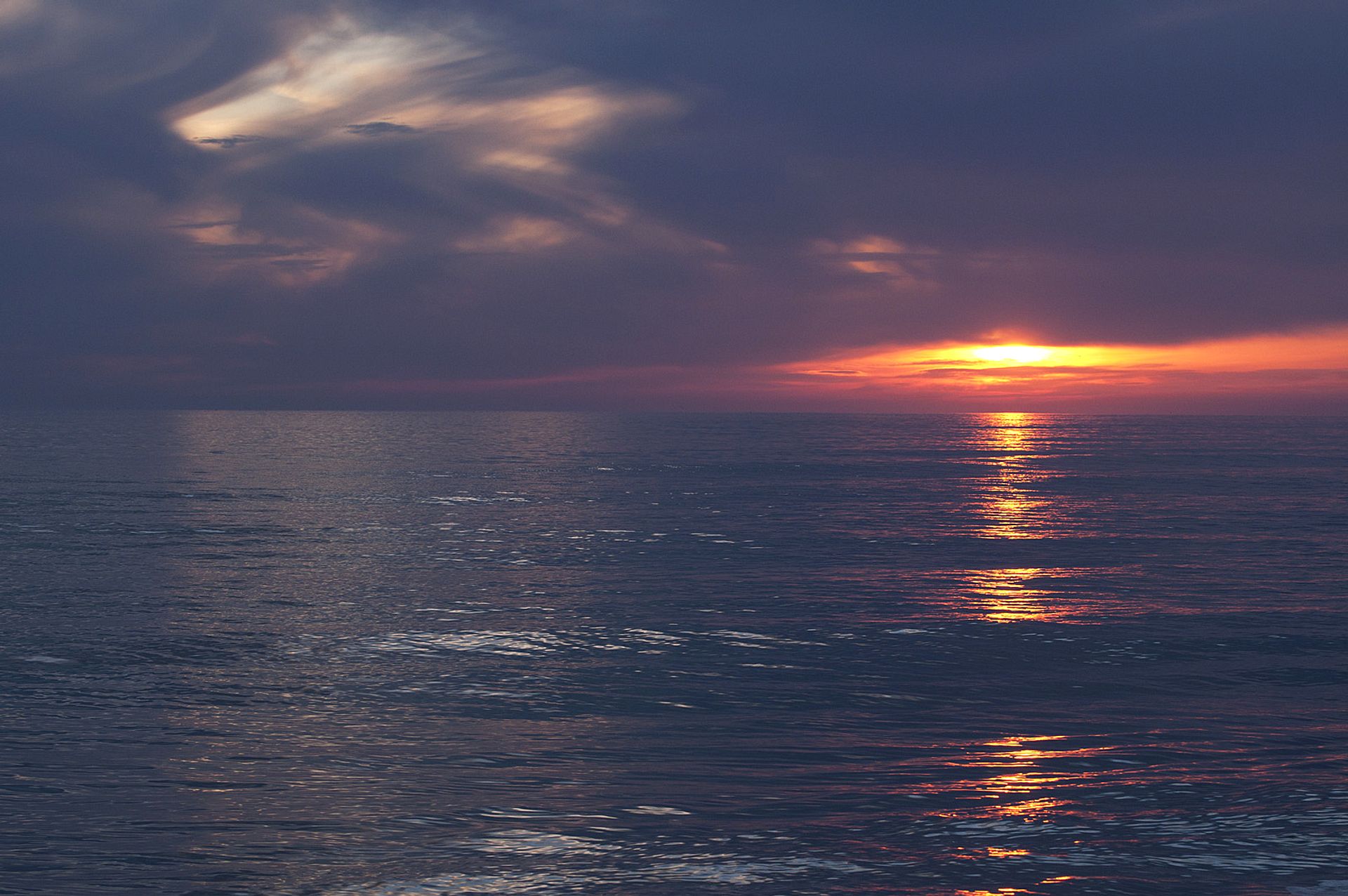 Sunset on the cloudy sea